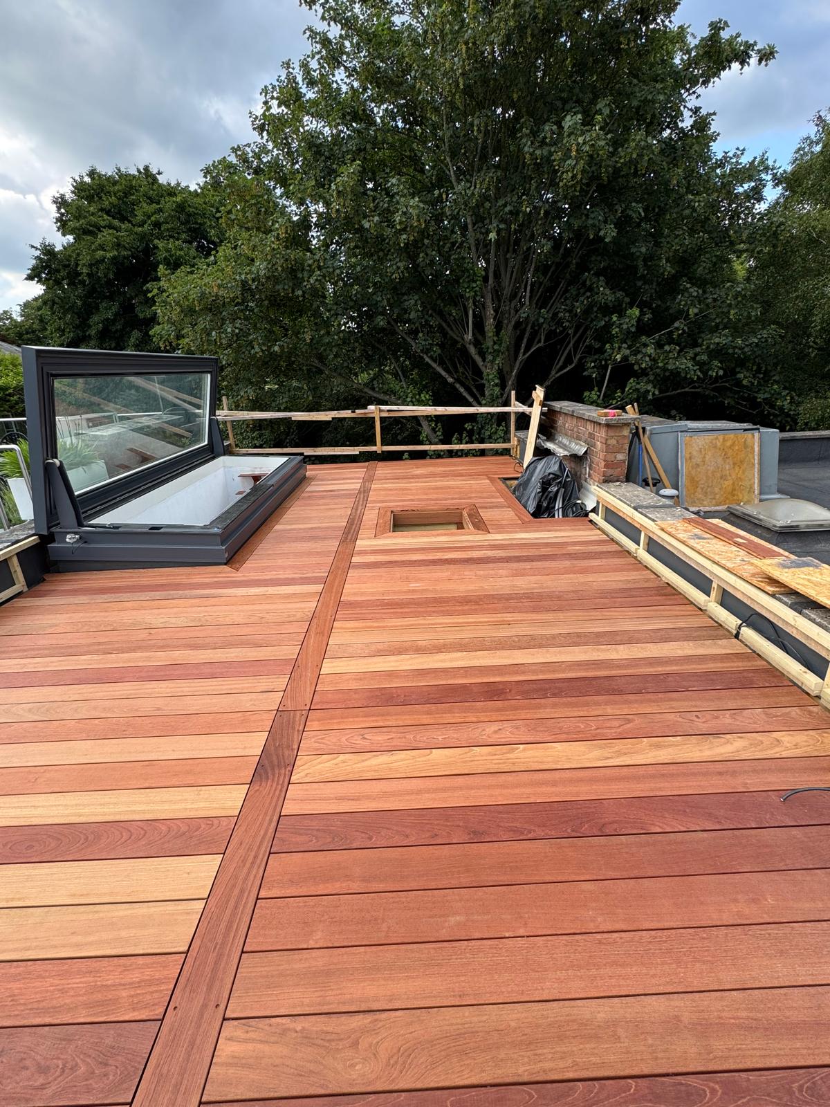 Rooftop timber decking with rooflight and framed access hatch